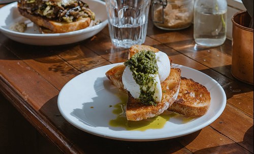 Plates on food on a wooden table