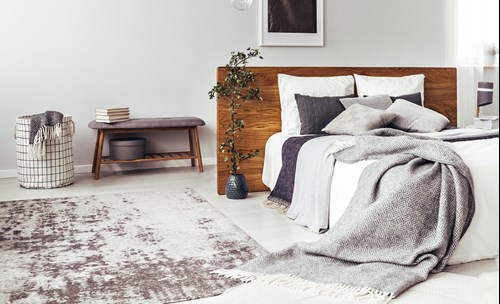 Bedroom interior - Bed, rug, side table, washing basket