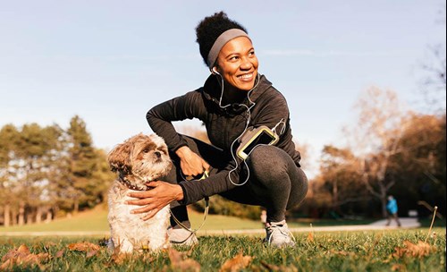 Woman in active wear with her dog