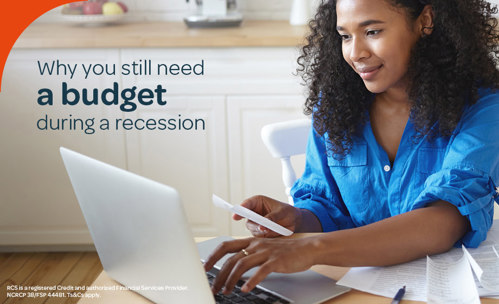 Woman working out her budget with her laptop and slips