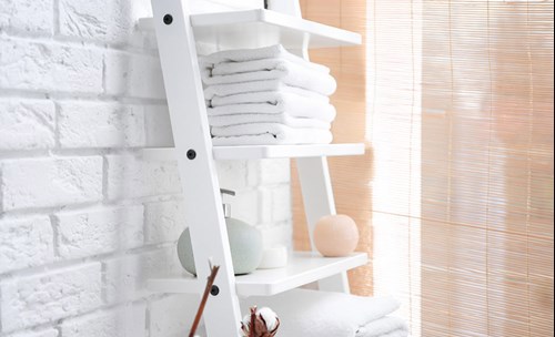 Bathroom interior - White shelf with white towels on