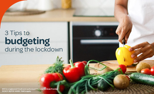 Woman cutting yellow pepper on cutting board