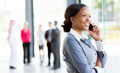 Business woman smiling while on a phone call