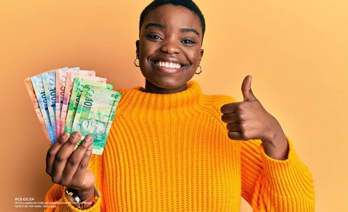 Smiling woman with cash in one hand