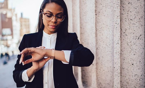 Woman looking at her watch