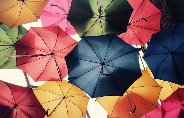 Colorful umbrellas symbolizing essential insurance types for financial protection