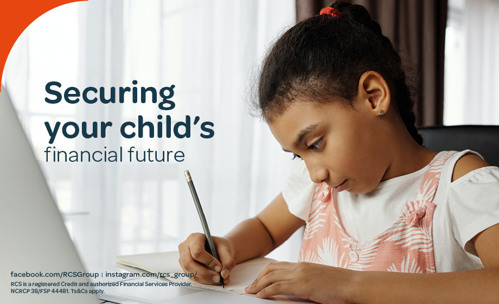 Girl sitting at a table and writing