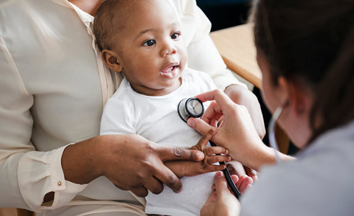 Baby getting a check up from doctor