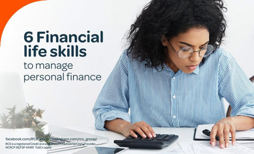 Woman looking at documents and using a calculator